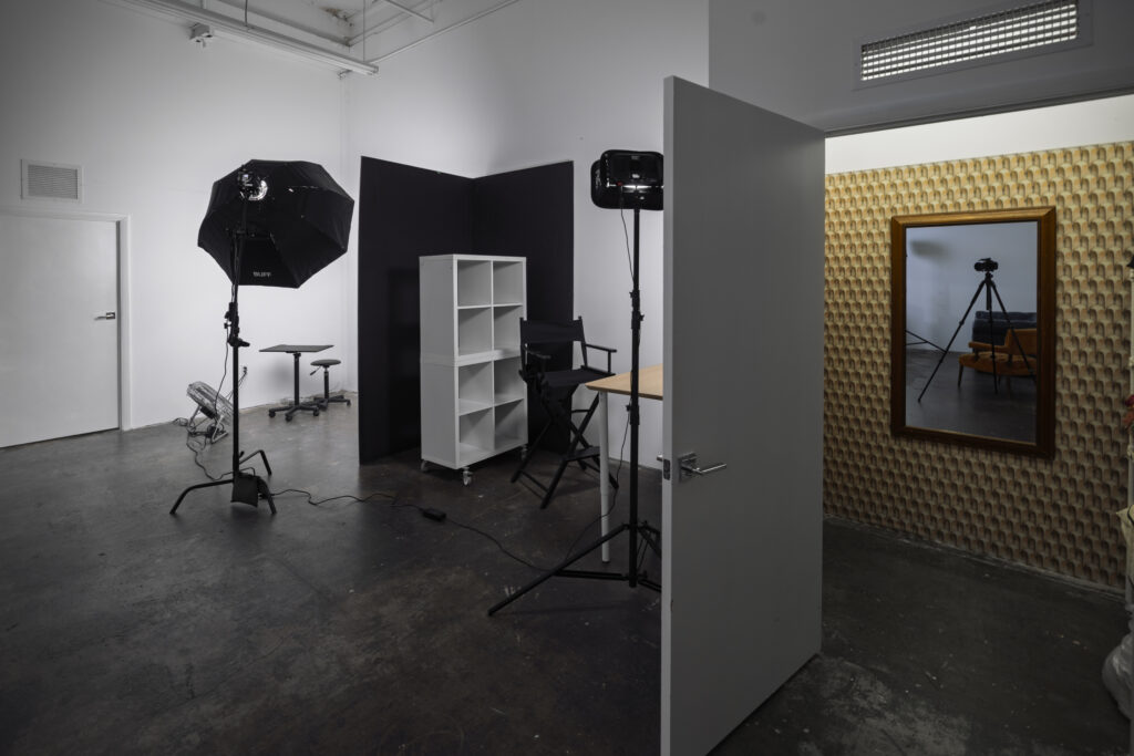 a changing room with a door open and a few objects